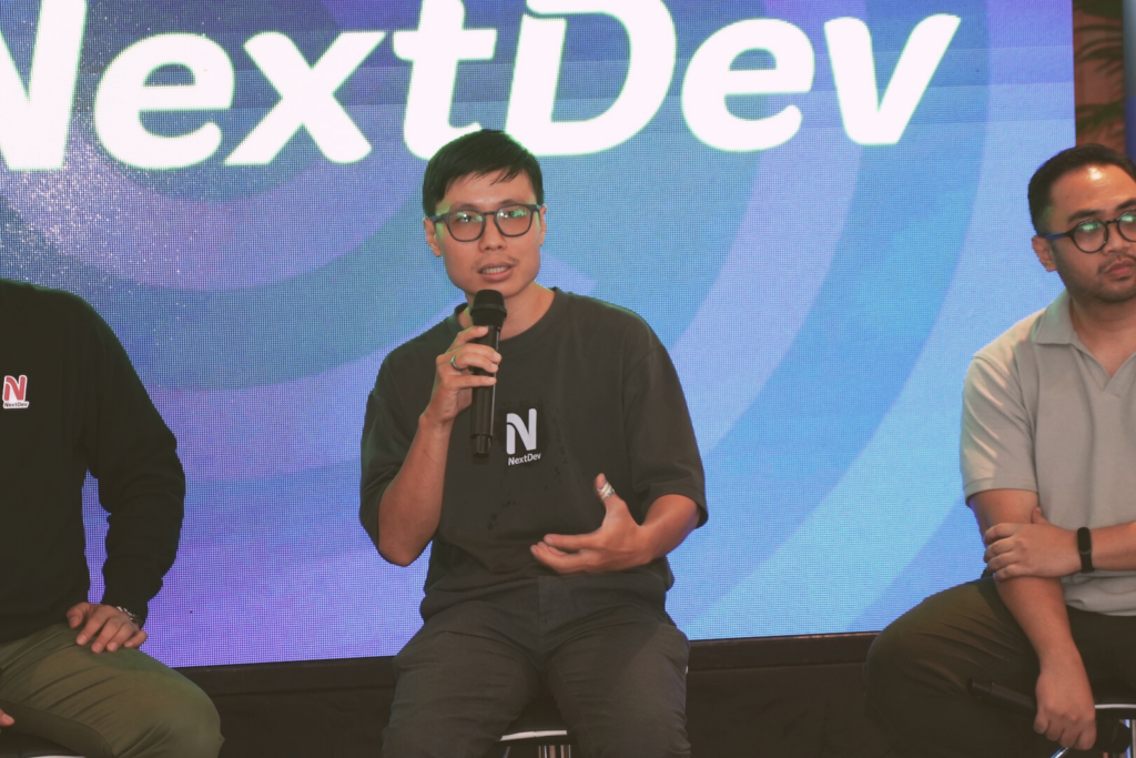 Hermanto answering questions in NextDev talkshow